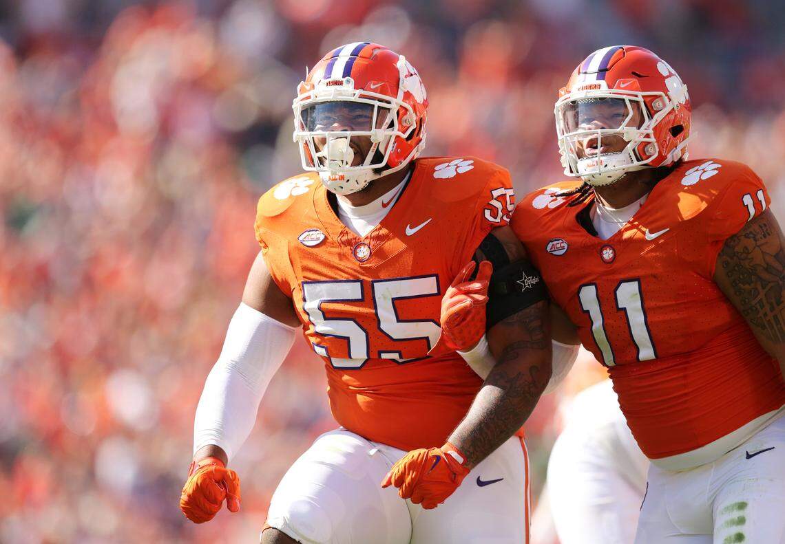 Clemson defensive tackle Payton Page (55) and Clemson defensive tackle Peter Woods (11) celebrate after helping take down Notre Dame quarterback Sam Hartman for a sack during first-half action in Clemson, S.C. on Saturday, Nov. 4, 2023. (Travis Bell/SIDELINE CAROLINA)