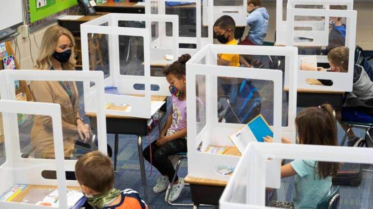 Students in Laura Jackson’s class at River Springs Elementary School read on Tuesday, October 6, 2020. In addition of masks and plastic barriers, students are not sharing learning materials.