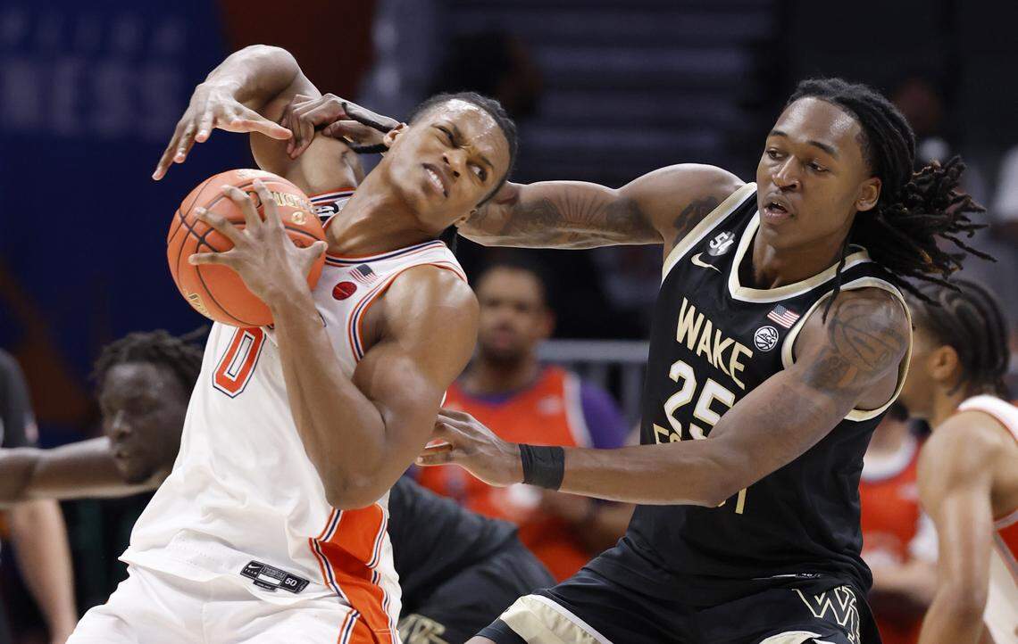 Wake Forest's Tre'von Spillers (25) fouls Clemson's RJ Godfrey during the second half of Clemson’s 71-62 victory over Wake Forest in the second round of the 2026 ACC Men’s Basketball Tournament at the Spectrum Center in Charlotte, North Carolina, Wednesday, March 11, 2026.