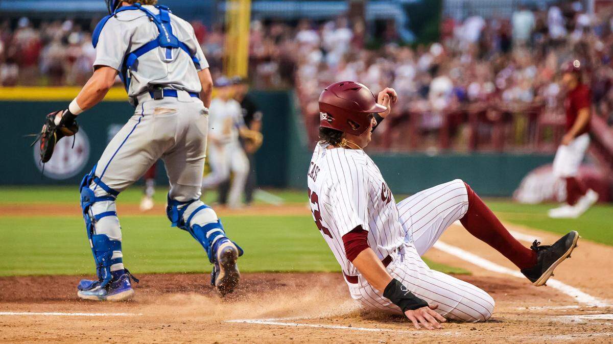 South Carolina Gamecocks infielder Gavin Casas (52) slides home with a run against the Central Conn. St. Blue Devils during their 2023 NCAA Columbia Regional game at Founders Park in Columbia, SC, Friday, June 2, 2023.
