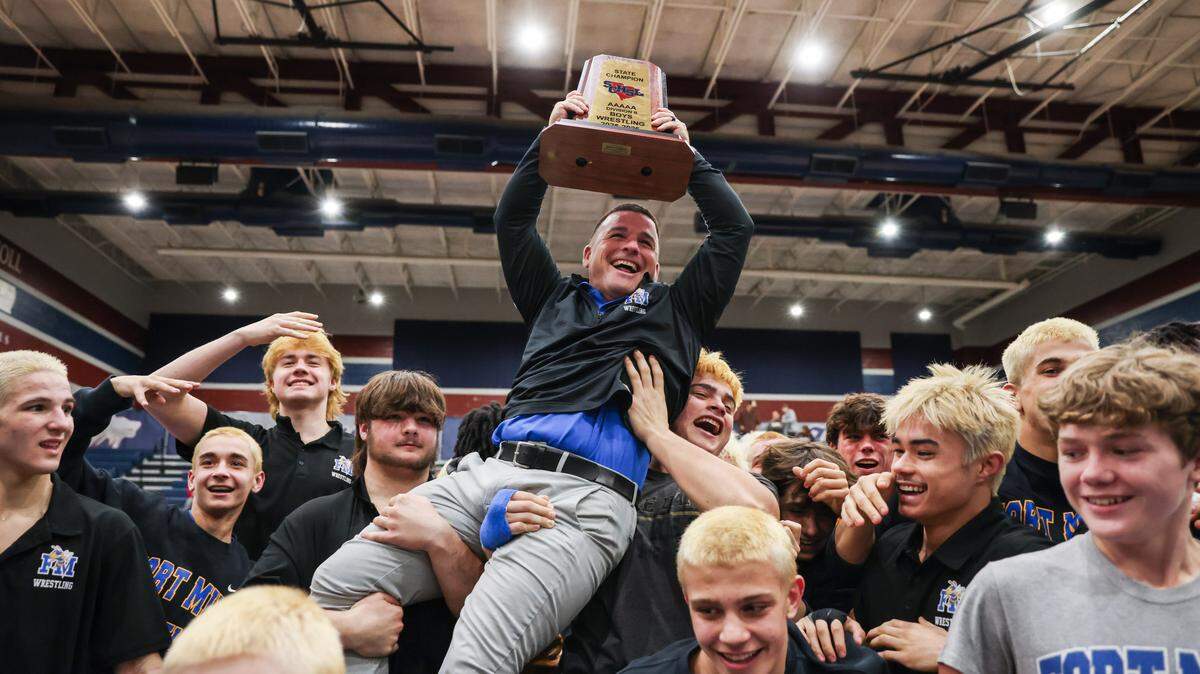 Fort Mill coach Adam Marullo celebrates following the SCHSL Class 5A Division II wrestling finals in Lexington on Wednesday, February 11, 2026.