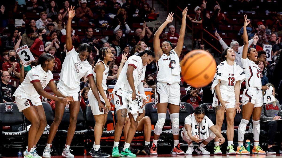 The Gamecocks celebrate as South Carolina’s Olivia Thompson (0) shoots for three during the second half of action against Charleston Southern in the Colonial Life Arena on Sunday, Dec. 18, 2022.