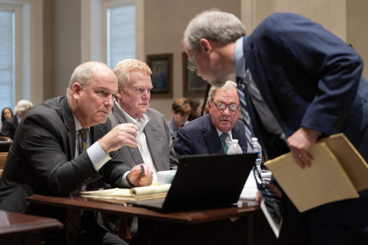 The defense speaks with prosecutor Creighton Waters during Alex Murdaugh’s trial for murder at the Colleton County Courthouse on Wednesday, Feb. 1, 2023. Joshua Boucher/The State/Pool