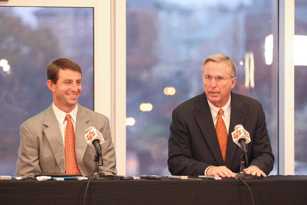 Former Clemson athletic director Terry Don Phillips (right) promoted Dabo Swinney (left) to football interim coach and later hired him full-time in 2008.
