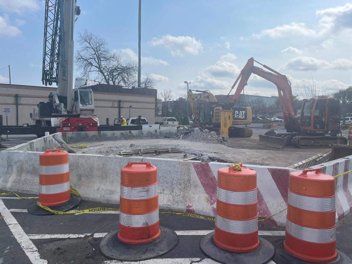 The “Busted Plug” fire hydrant sculpture is moved from its longtime spot on Taylor Street on Thursday, Feb. 23