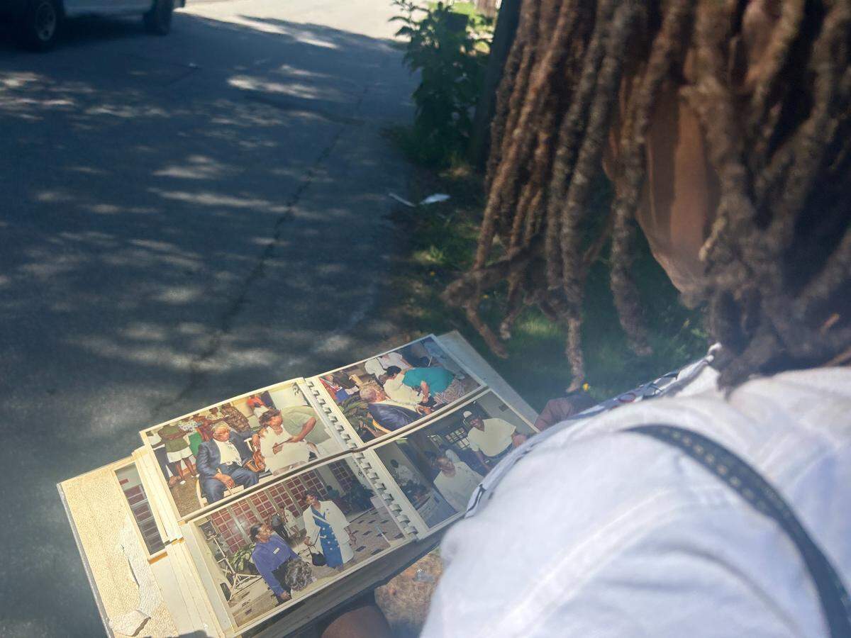 Woman looks at old photos of her mother.