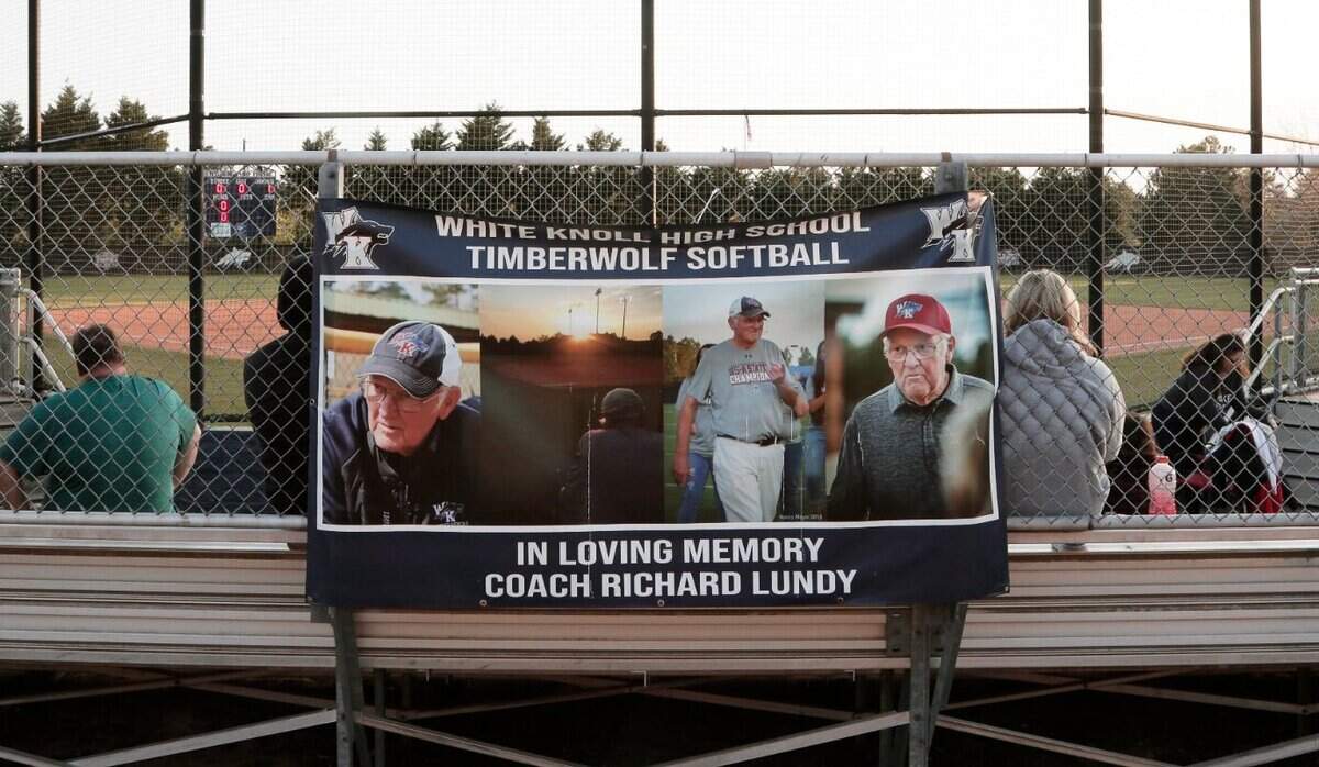 A sign at White Knoll High School honors the late assistant coach Richard Lundy.