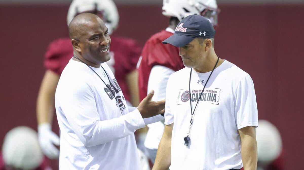 South Carolina head coach Shane Beamer speaks with defensive coordinator Clayton White during practice in Columbia on Saturday, August 2, 2025.