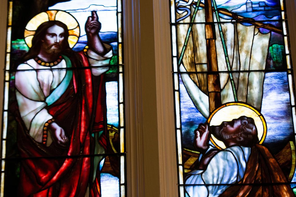 A stained glass window depicting Luke 5:8 at St. Peter’s Basilica in downtown Columbia, South Carolina on Thursday, April 2, 2020. To prevent the spread of the coronavirus, only staff are allowed to attend services and mass is streamed from an iPhone in the balcony using Facebook Live.
