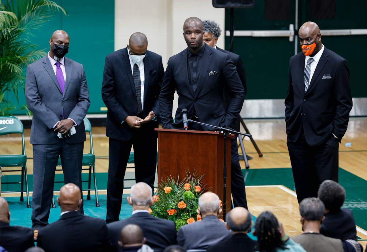 Jermaine O’Neal, surrounded by former Eau Claire basketball players, speaks about coach George Glymph during funeral services Dec. 22 for Glymph at Eau Claire High School. The Columbia native coached for 32 years, leading Eau Claire to five state titles between 1974 and 1996.
