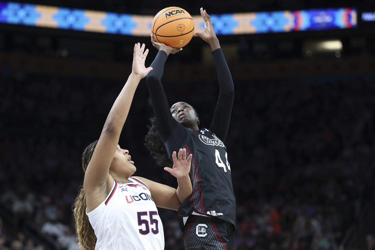South Carolina's Agot Makeer (44) shoots as University of Connecticut’s Sarah Strong pressures during the second half of action of their women's basketball game in the NCAA Tournament semifinals against UConn at Mortgage Matchup Center in Phoenix on Friday, April 3, 2026.
