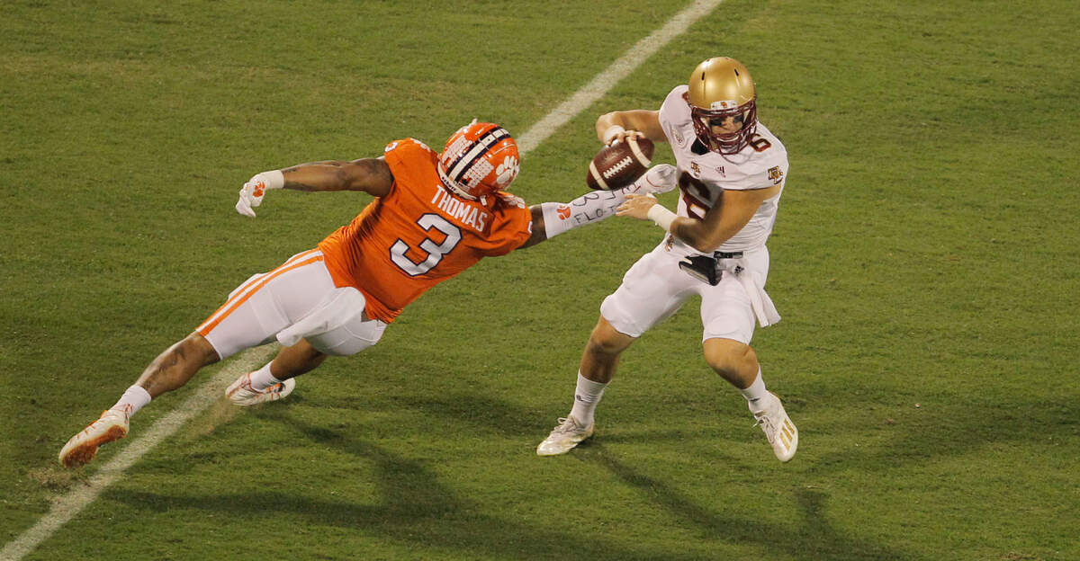 Clemson defensive end Xavier Thomas (3) gets pressure on Boston College quarterback Dennis Grosel (6) during first-quarter action in Clemson, S.C. on Saturday, Oct. 2, 2021. (Travis Bell/SIDELINE CAROLINA)