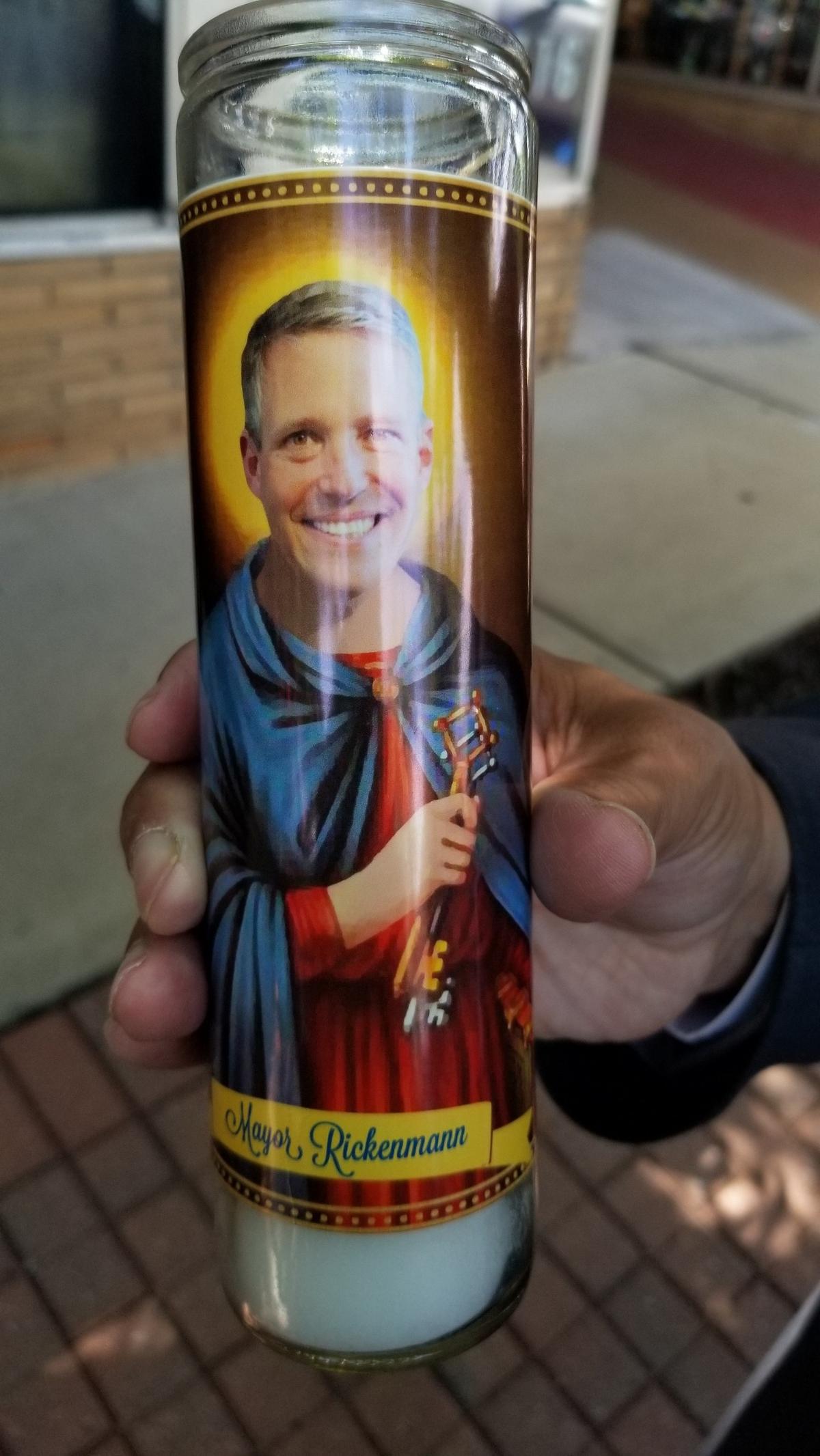 The owner of Five Points’ Botanica de Santee presented Columbia Mayor Daniel Rickenmann with a votive candle with the mayor’s picture on it.