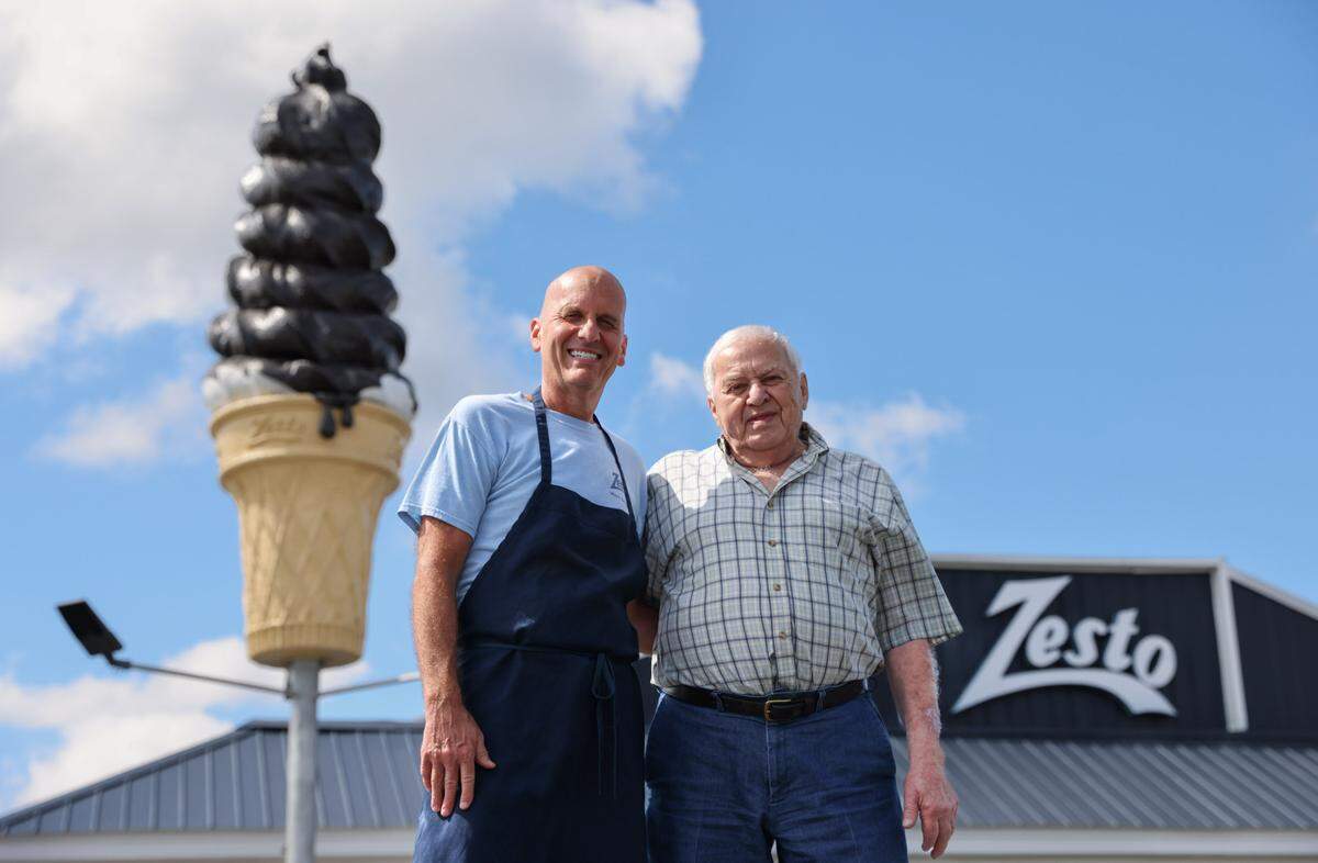 Pete Manos, left, and his father Gus are pictured in front of their restaurant, Zesto of West Columbia, on Monday, May 20, 2024. The establishment, which opened in 1949, is celebrating its 75th year in business. 