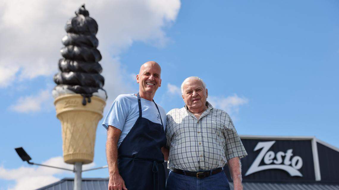 Pete Manos, left, and his father Gus are pictured in front of their restaurant, Zesto of West Columbia, on Monday, May 20, 2024. The establishment, which opened in 1949, is celebrating its 75th year in business.