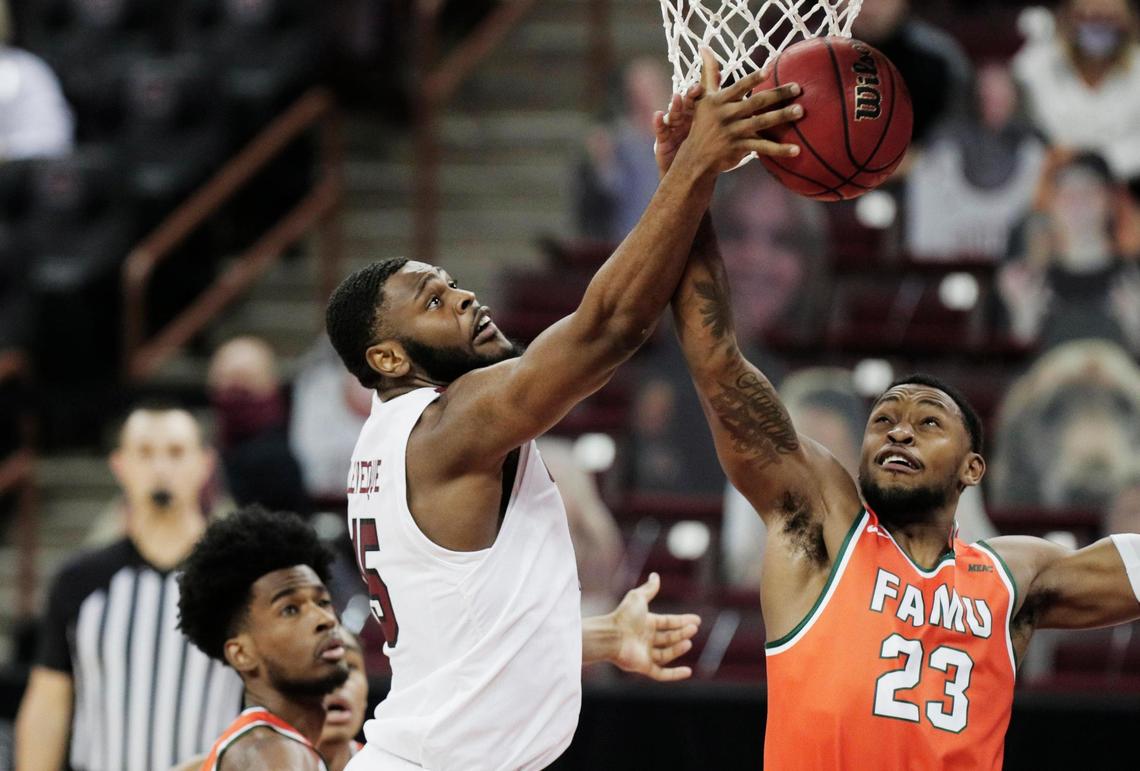 South Carolina Gamecocks forward Wildens Leveque (15) is blocked by Florida A&M Rattlers forward Bryce Moragne (23) on January 2, 2021.
