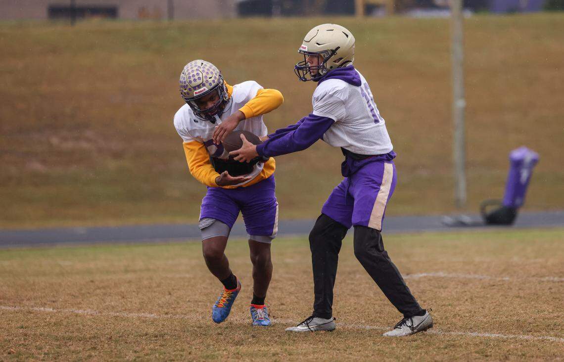 Tanner Watkins (16) fakes a handoff to Amadre Wooden (22) during practice at Batesburg-Leesville High School on Tuesday, November 19, 2024.