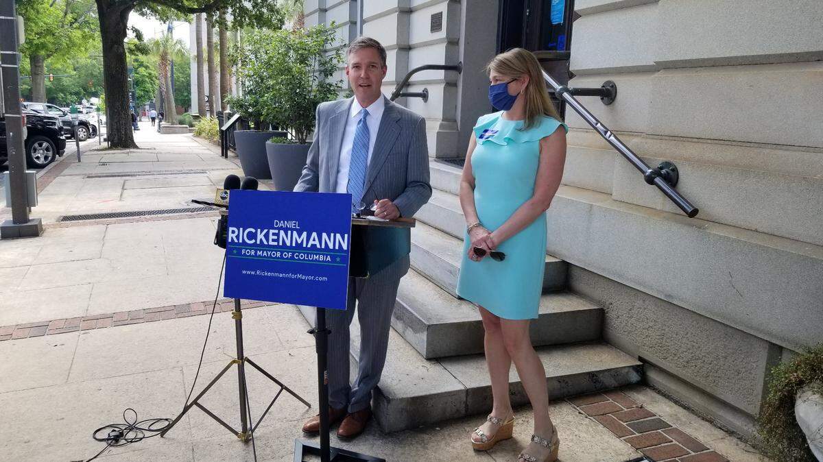 Columbia City Councilman Daniel Rickenmann, left, announces his campaign for mayor on Wednesday, April 28, 2021 as his wife, Dr. Laura Rickenmann, listens outside of Columbia City Hall.
