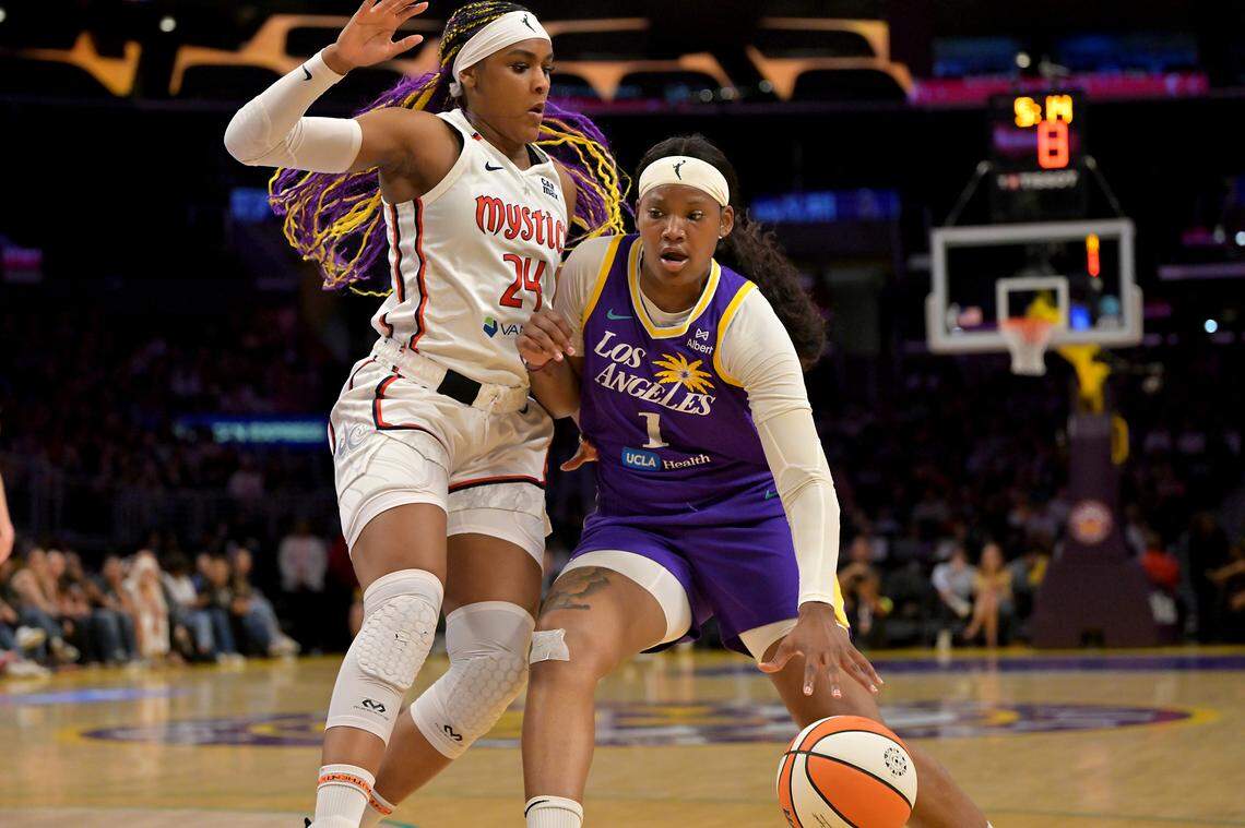 Los Angeles Sparks forward Sania Feagin (1) in July against Washington Mystics forward Aaliyah Edwards (24).