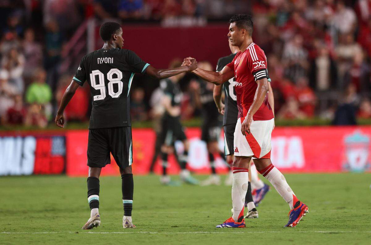 Liverpool midfielder Trey Nyoni (98) and Manchester United midfielder Casemiro (18) shake hands following the Rivals in Red International Friendly soccer match between Manchester United and Liverpool in Columbia on Saturday, August 3, 2024.