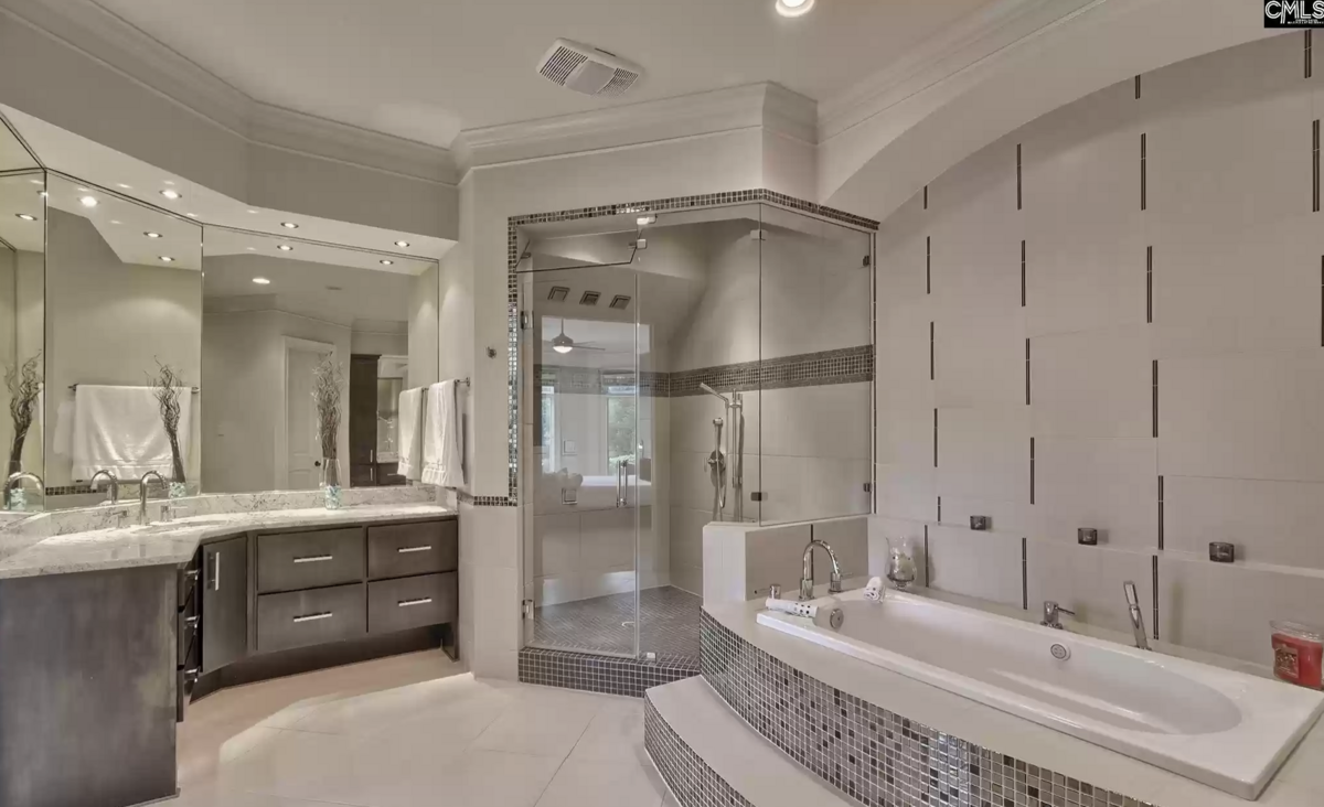 The property has five bedrooms, two full bathrooms and two half bathrooms.