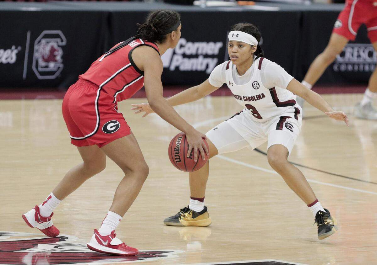 Georgia Lady Bulldogs guard Chloe Chapman (1) is blocked by South Carolina Gamecocks guard Destanni Henderson (3) at Colonial Life Arena on Thursday, January 21, 2021.
