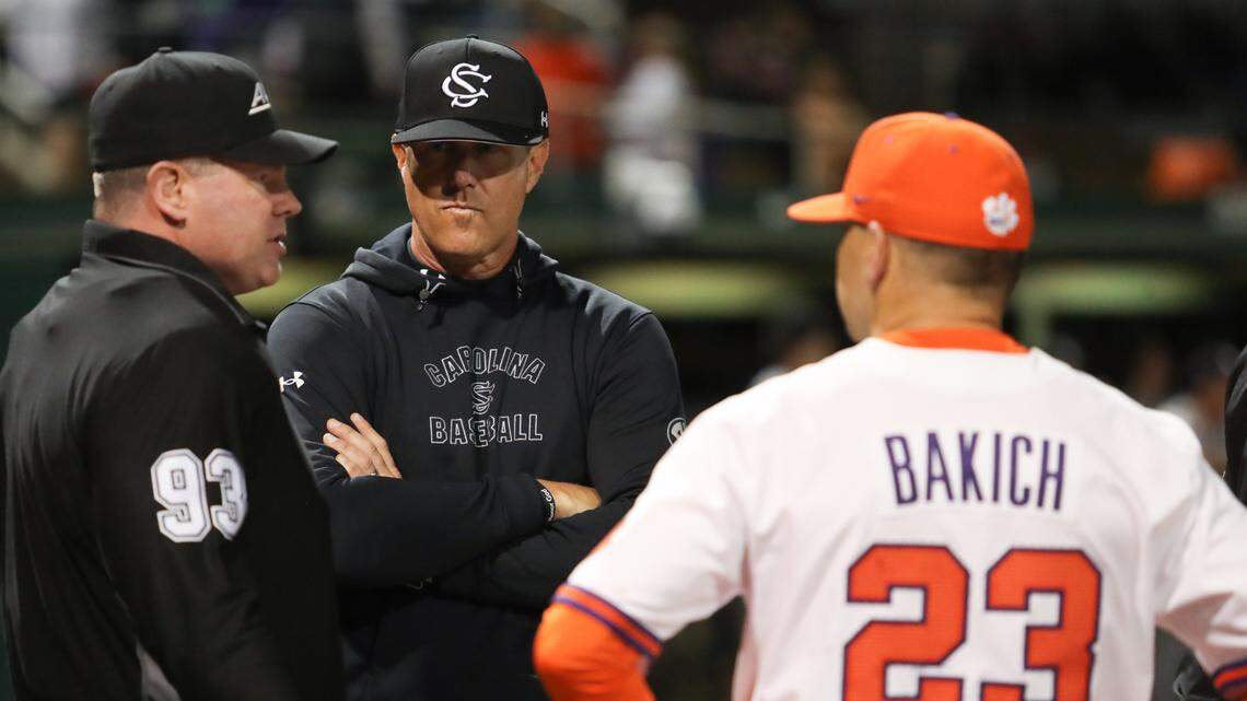 South Carolina Gamecocks head coach Mark Kingston and Clemson Head Coach Erik Bakich meet at home plate prior to the game at Doug Kingsmore Stadium in Clemson on March 3 , 2023.