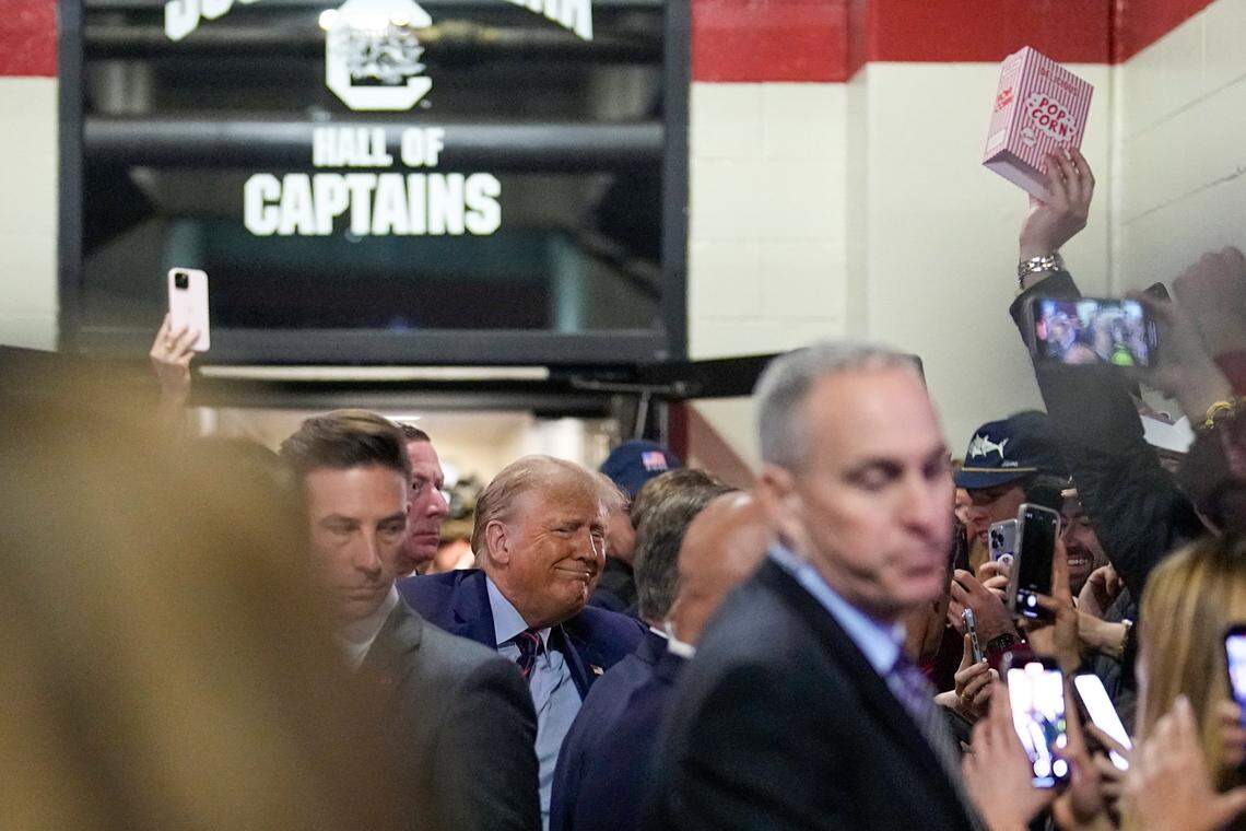 Republican presidential candidate and former President Donald Trump arrives before an NCAA college football game between the University of South Carolina and Clemson Saturday, Nov. 25, 2023, in Columbia, S.C. (AP Photo/Chris Carlson)