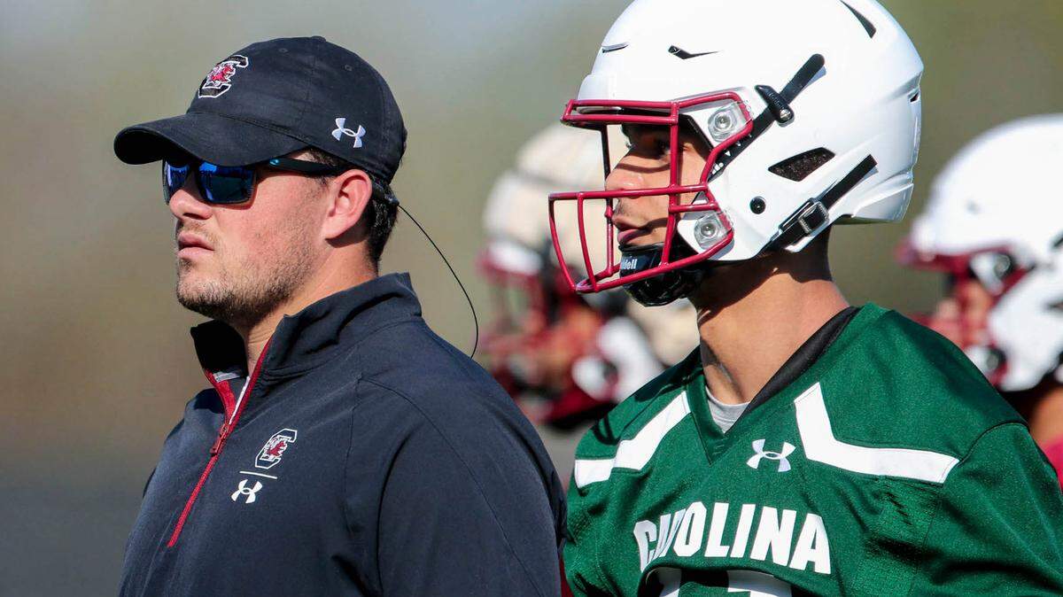 University of South Carolina quarterback Branden Davis (11) watches drills wit Zeb Noland during spring practice.