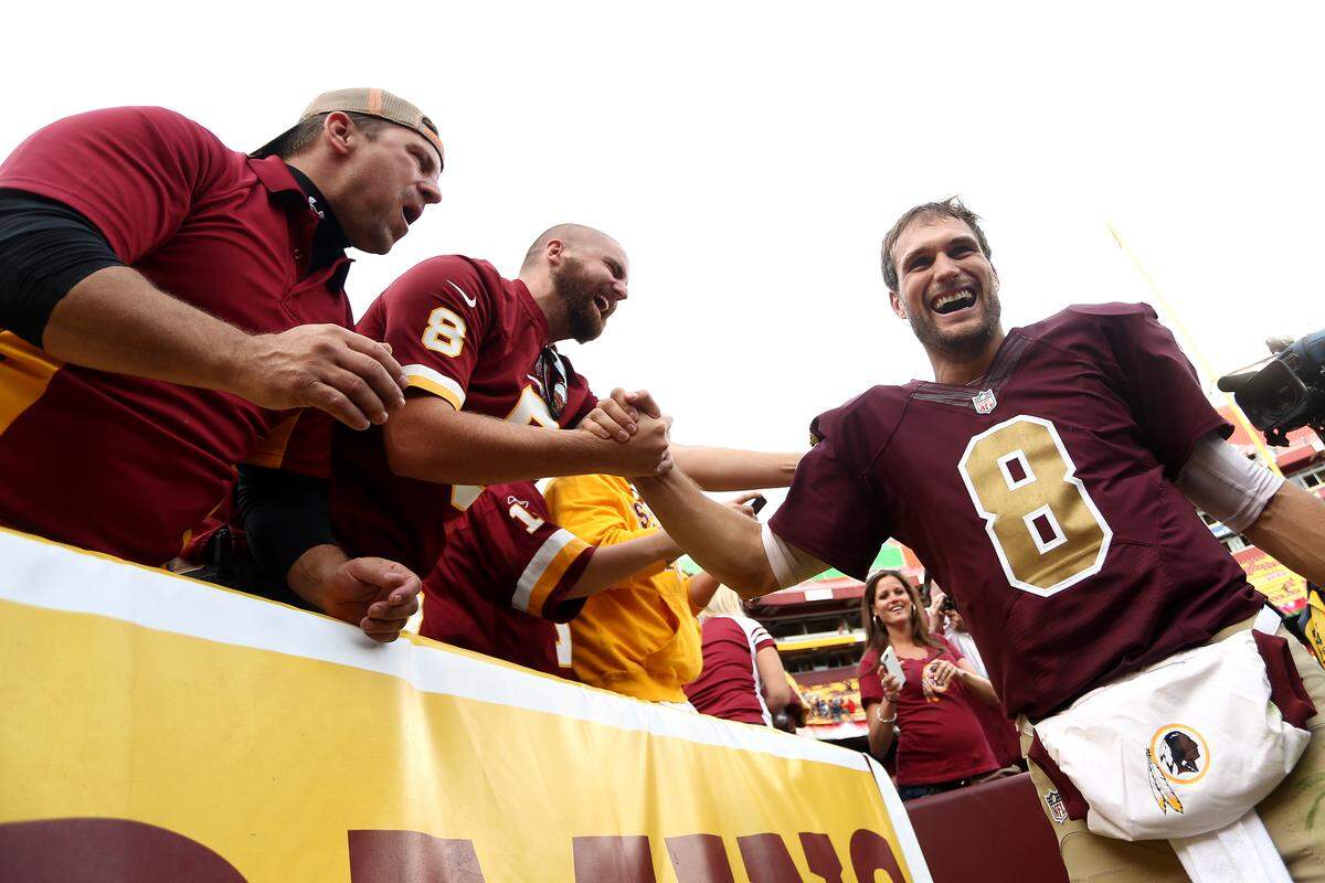 LANDOVER, MD - OCTOBER 25: Quarterback Kirk Cousins #8 of the Washington Redskins celebrates with fans after defeating the Tampa Bay Buccaneers 31-30 during a game at FedExField on October 25, 2015 in Landover, Maryland.