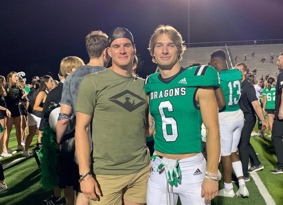 Gavin (left) and Landon Samson (right) pose together after a Southlake Carroll football game. Landon signed with South Carolina as a member of its 2022 recruiting class.