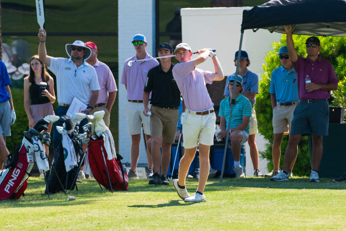 AC Flora’s Luke Sullivan hits a shot at the 2022 Class 4A state golf championship at Forest Lake.