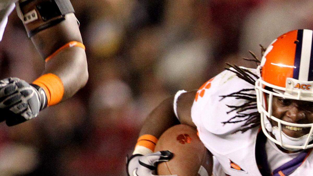 Clemson's Andre Ellington makes a first down against the University of South Carolina in the first half at William-Brice Stadium in Columbia, S.C..
