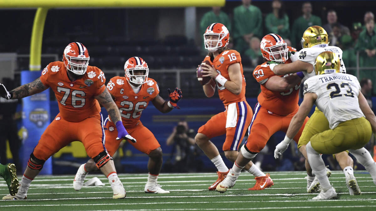 Clemson quarterback Trevor Lawrence (16) drops back to pass during the NCAA Cotton Bowl semi-final playoff football game, Saturday, Dec. 29, 2018, in Arlington, Texas. (AP Photo/ Jeffrey McWhorter)