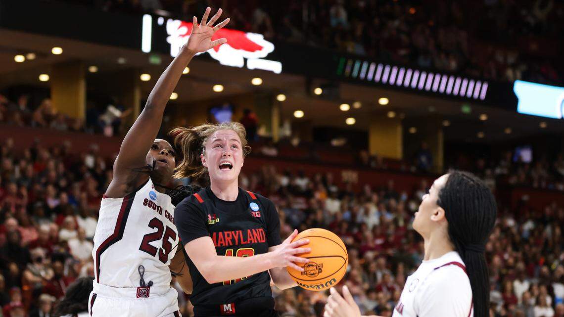 Maryland Terrapins guard Abby Meyers (10) is guarded by South Carolina Gamecocks guard Raven Johnson (25) during the Elite 8 round of the 2023 NCAA Tournament at Bon Secours Wellness Arena in Greenville on Monday, March 27, 2023.