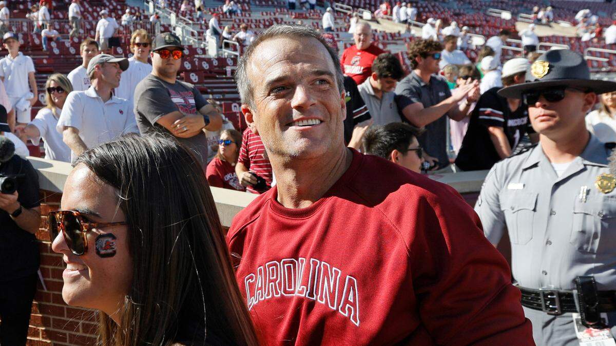 South Carolina head coach Shane Beamer smiles as he leaves the field after a win over Oklahoma, Saturday, Oct. 19, 2024, at Gaylord Family - Oklahoma Memorial Stadium in Norman, Okla. South Carolina won 35-9.