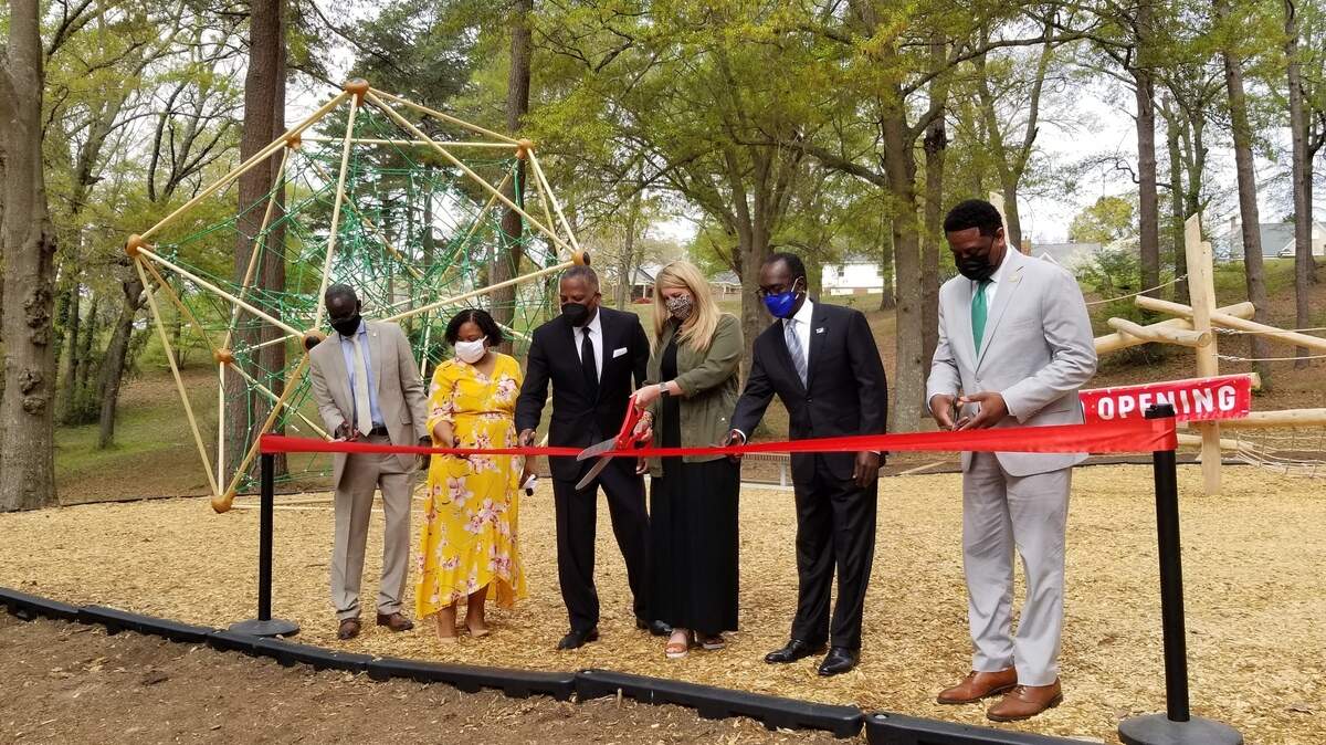 City officials and neighborhood leaders cut a ribbon at the new playground at Marshall Park on March 30, 2021. From left are Columbia parks director Randy Davis, City Councilwoman Tameika Isaac Devine, Mayor Steve Benjamin, Earlewood Neighborhood Association president Emily Burn, City Councilman Sam Davis and Assistant City Manager Henry Simons.