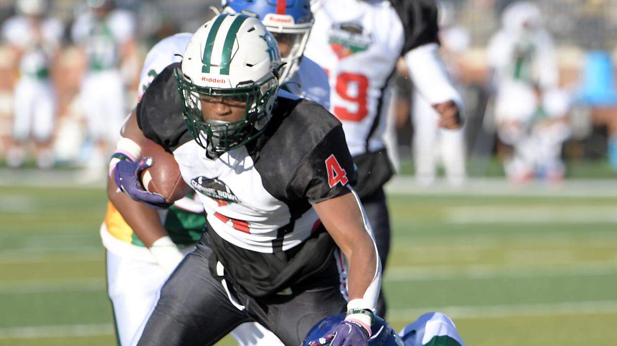 South Carolina’s Jarvis Green breaks the tackle of Nigel Lucas and scores. The Shrine Bowl of the Carolinas 86th annual Shrine Bowl Game was played at Spartanburg High School Saturday, December 17, 2022. GWINN DAVIS MEDIA