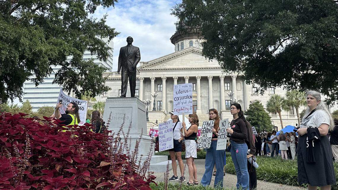 Protesters gather outside the statehouse as South Carolina Senators prepare to hear testimony on a near total abortion ban Wednesday, Oct. 1, 2025 in Columbia.