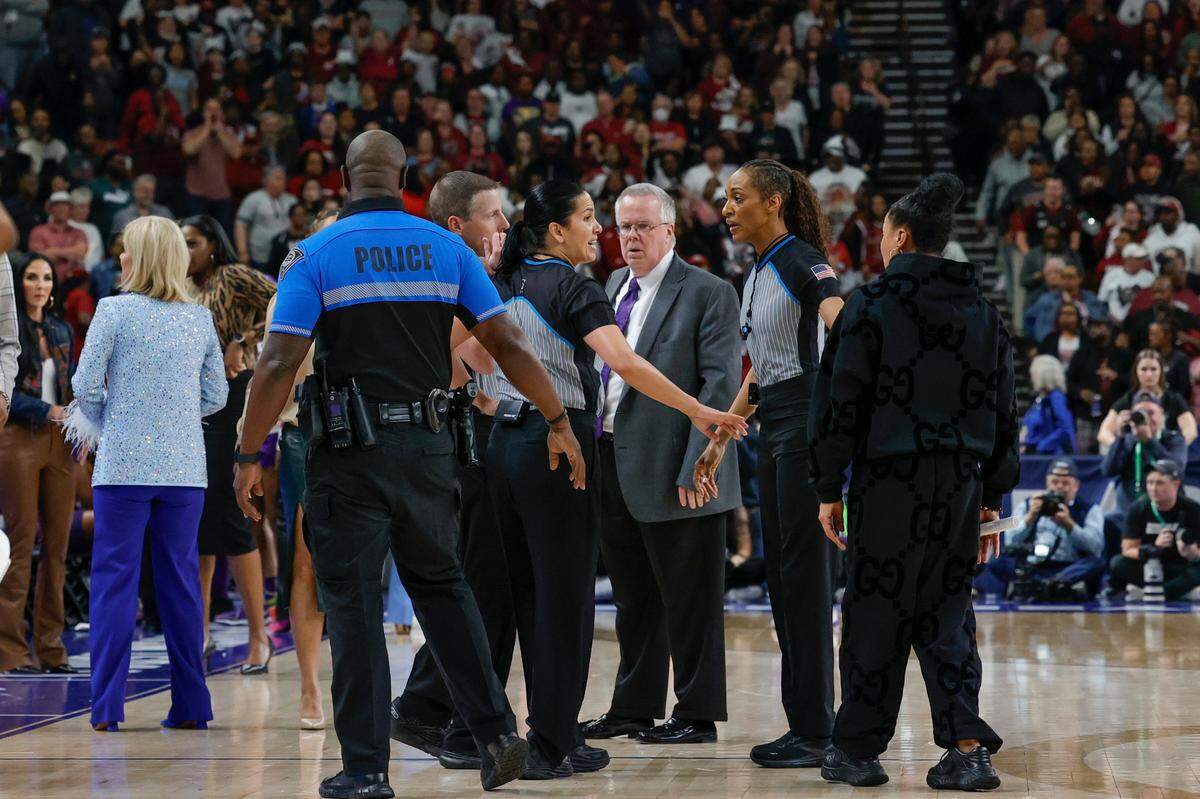 Police stand on court in the aftermath of an altercation on court with LSU players during the second half of action in the SEC Tournament Championship game at Bon Secours Wellness Arena in Greenville on Sunday, Mar. 10, 2024.