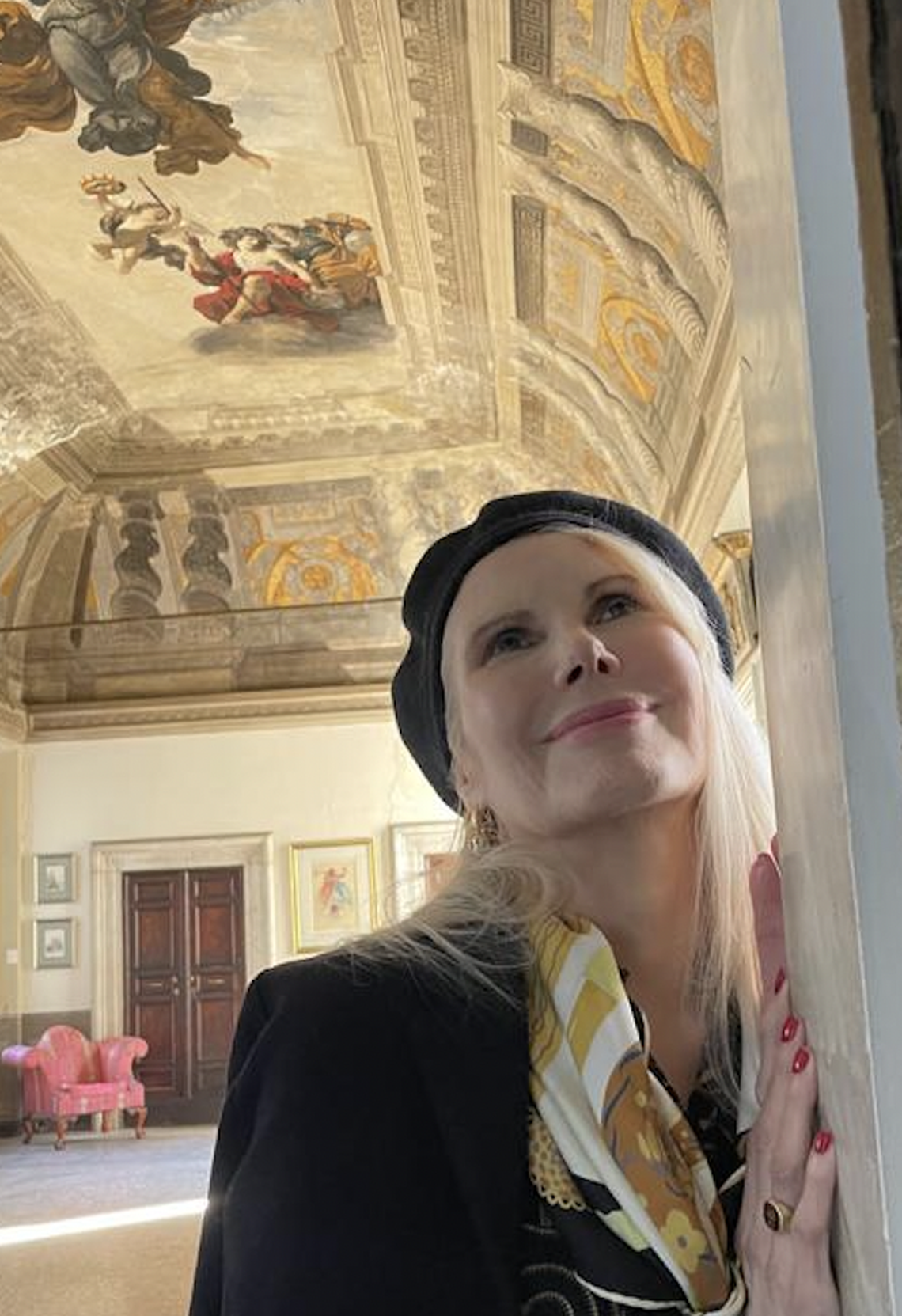 Princess Rita Boncompagni Ludovisi with the Caravaggio mural above her in her Villa Aurora.
