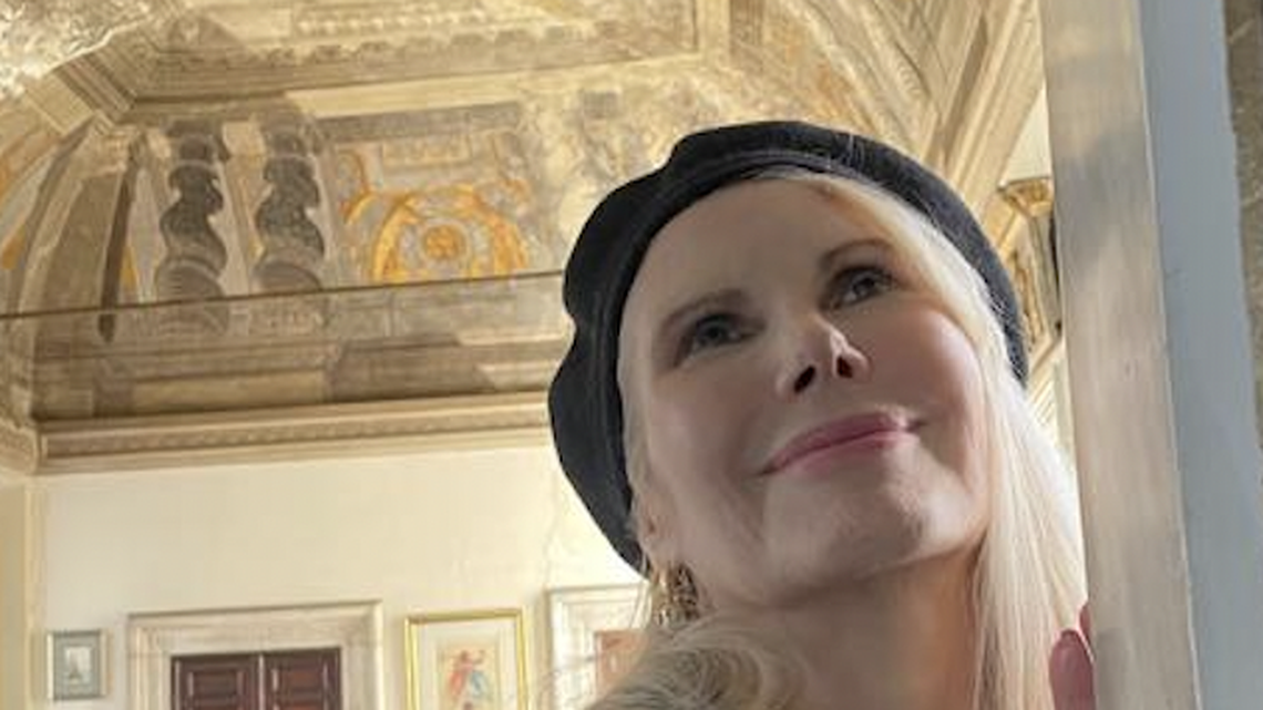 Princess Rita Boncompagni Ludovisi with the Caravaggio mural above her in her Villa Aurora.