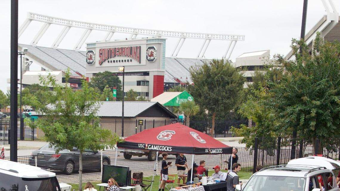 Fans gather Saturday in the privately operated Softdocs parking lot on Bluff Road before of the South Carolina football season opener against Tennessee at Williams-Brice Stadium in 2020.