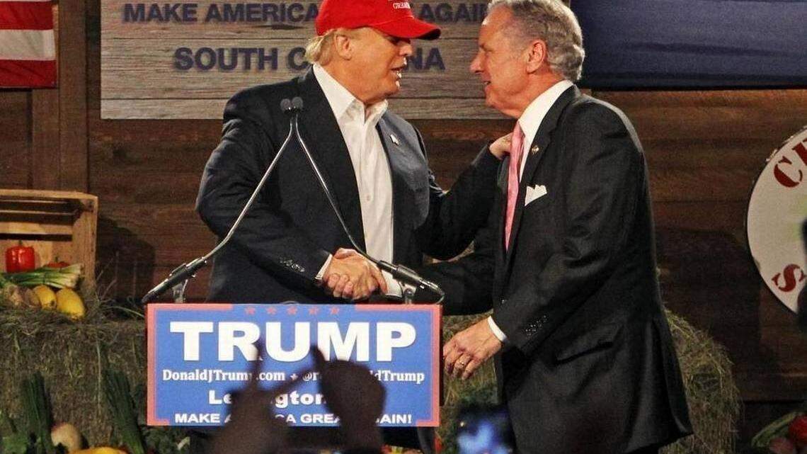 Then-candidate and now President Donald Trump shakes hands with S.C. Gov. Henry McMaster during a 2016 stop in Gilbert, South Carolina.