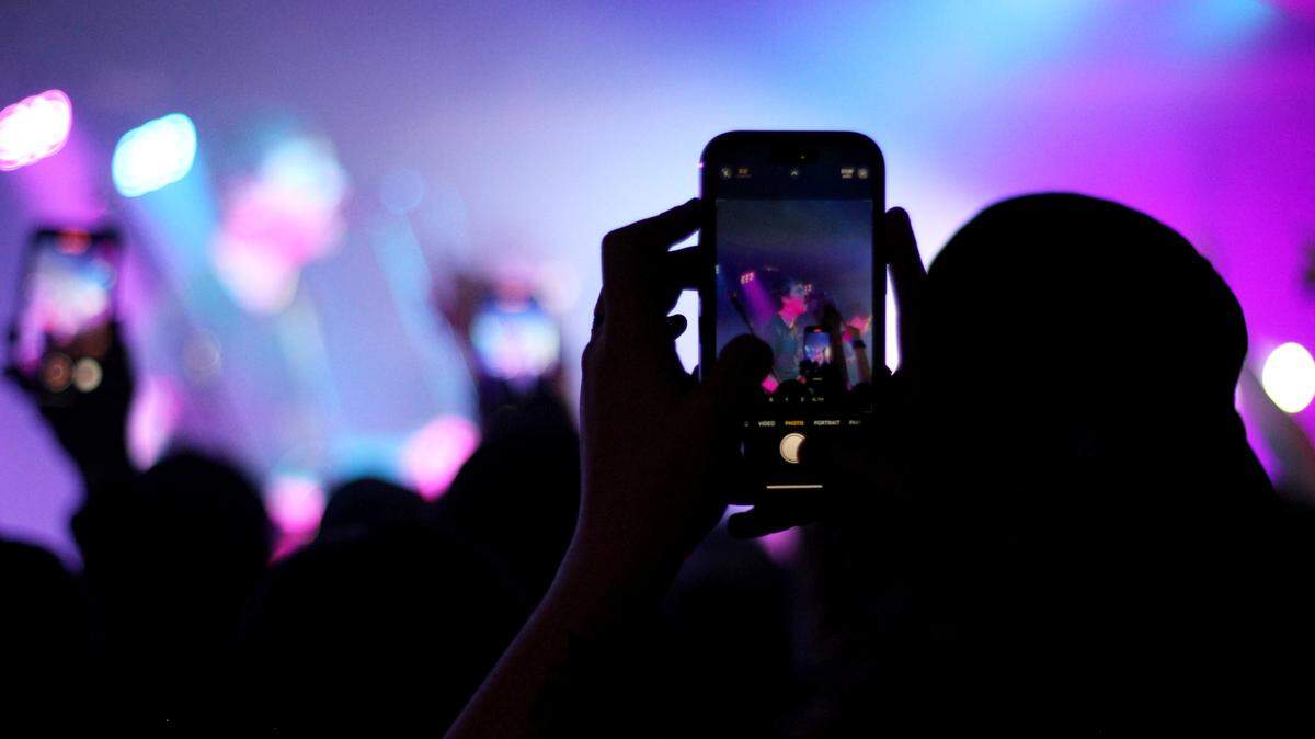 Excited attendees attempt to capture the moment during a March 11, 2024 performance by the band Joyce Manor at New Brookland Tavern.