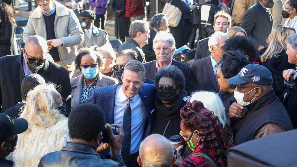 Daniel Rickenmann greets people and is photographed after gbeing sworn in as Columbia’s new mayor during an inauguration ceremony on Main Street in Columbia on Tuesday, Jan. 4, 2022.