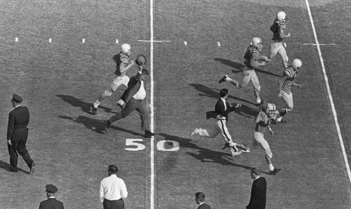 Members of USC’s Sigma Nu fraternity are chased off the field after pulling a stunt in 1961 in which they pretended to be the Clemson football team. Fans were clued into the prank after the brothers performed a variety of silly warm up drills.