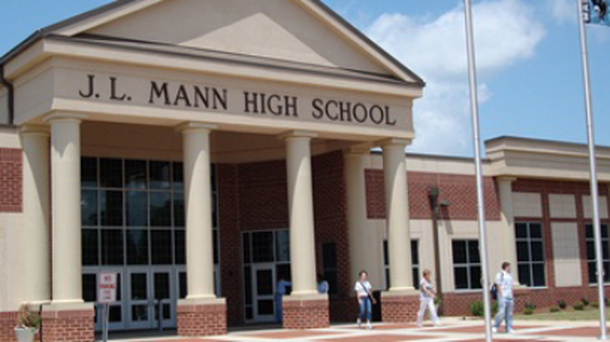 A student at J.L. Mann High School in Greenville County has been charged with making threats against the school.