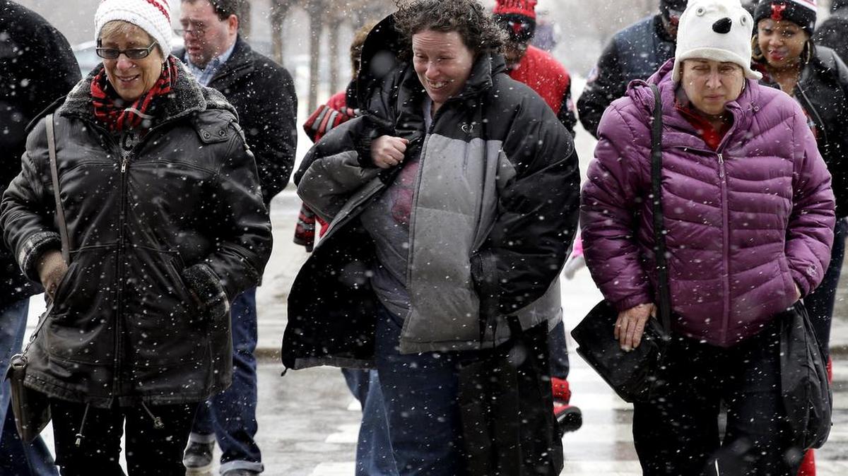 People walking through the snow (AP Photo/Nam Y. Huh)