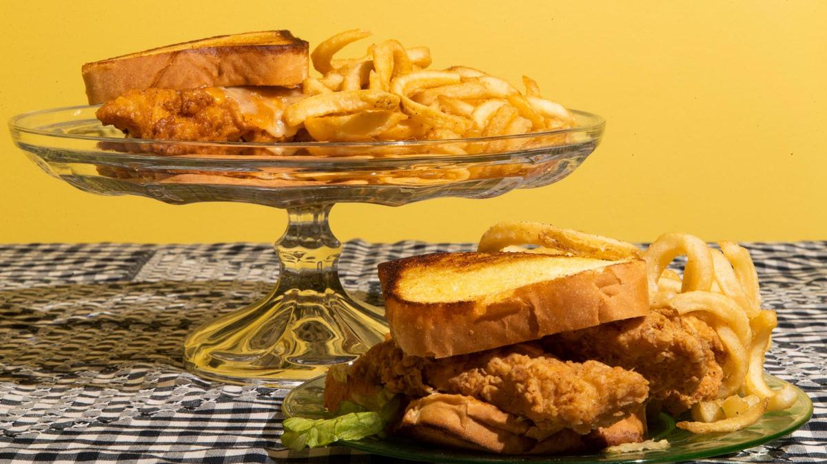Two chicken strip sandwiches, both made at Hooters, but one marketed under the Hootie’s Chicken Tenders brand on delivery apps. While both items look very similar, the sandwich from Hootie’s Chicken Tenders was $7.69 and the sandwich from Hooter’s was $15.72.